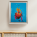 Sagrado Corazón framed art print by El Zanate displayed on a wall above a rattan credenza – sacred heart with flames on blue background